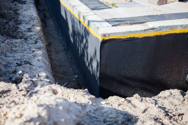 Professional Basement Waterproofing technician working in Greenwich, NJ